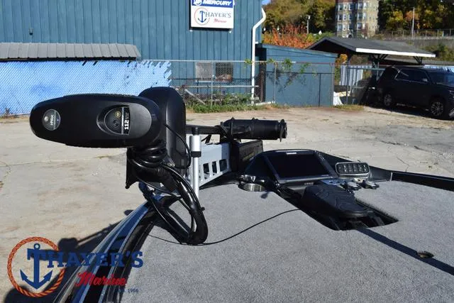 Slide: The Image of 2018 Triton 21 TrX boat with advanced navigation equipment at Thayer's Marine. - 11