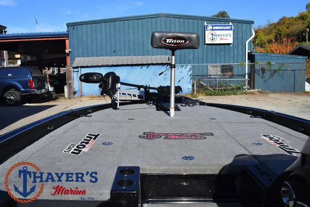 Slide: The Image of 2018 Triton 21 TrX boat at Thayer's Marine dealership. - 14