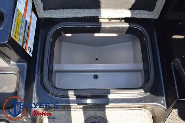 Slide: The Image of 2018 Triton 21 TrX boat storage compartment, open and empty. - 20