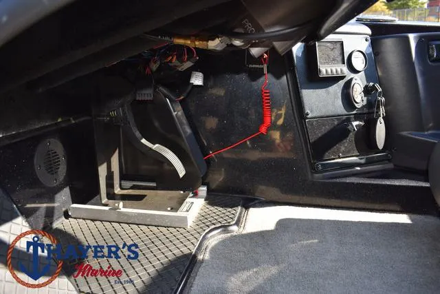 Slide: The Image of Interior view of 2018 Triton 21 TrX boat cockpit with control panel and foot pedal. - 31