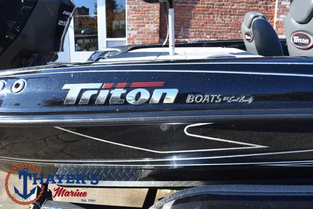 Slide: The Image of 2018 Triton 21 TrX boat at Thayer's Marine dealership. - 4
