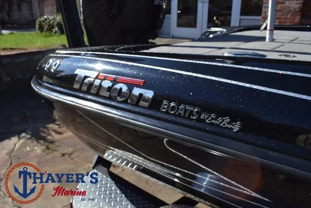 Slide: The Image of 2018 Triton 21 TrX boat at Thayer's Marine dealership. - 42