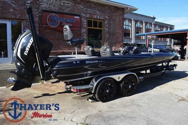 Slide: The Image of 2018 Triton 21 TrX boat at Thayer's Marine dealership, featuring Evinrude engine. - 46