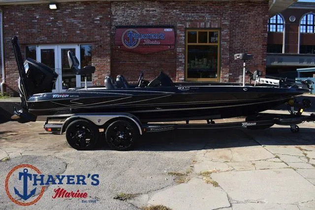 Slide: The Image of 2018 Triton 21 TrX boat at Thayer's Marine dealership. - 47