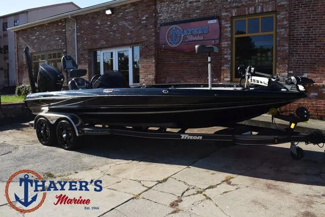 Slide: The Image of 2018 Triton 21 TrX boat at Thayer's Marine dealership. - 48