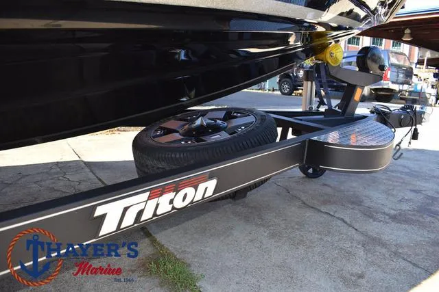 Slide: The Image of 2018 Triton 21 TrX boat trailer at Thayer's Marine. - 7