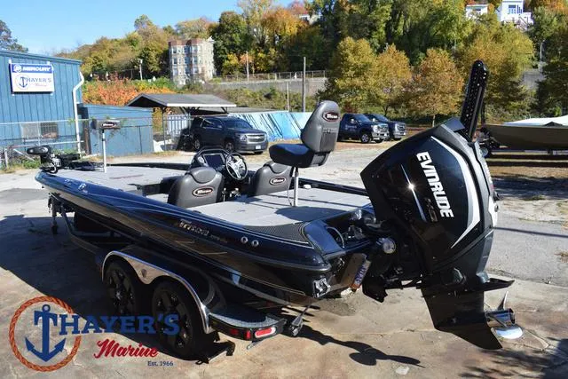 Slide: The Image of 2018 Triton 21 TrX bass boat with Evinrude engine at Thayer's Marine dealership. - 9