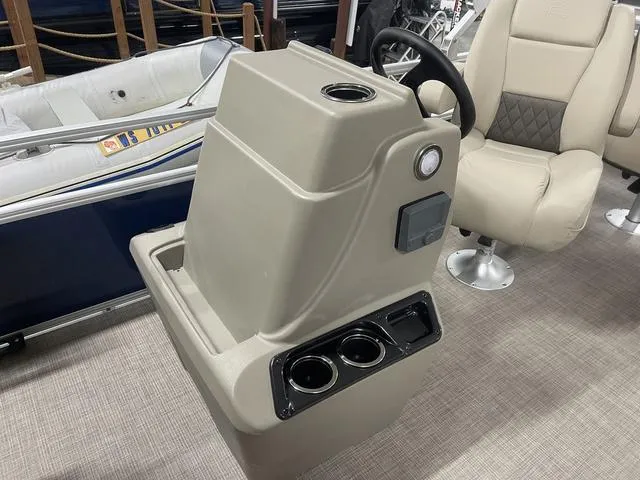 Slide: The Image of 2025 Sun Tracker Bass Buggy 18 DLX interior with seating and console. - 14