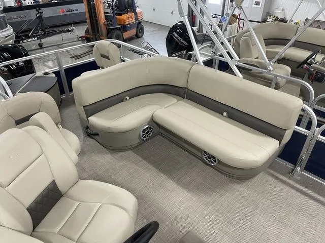 Slide: The Image of 2025 Sun Tracker Bass Buggy 18 DLX boat console with cup holders and storage compartment. - 16