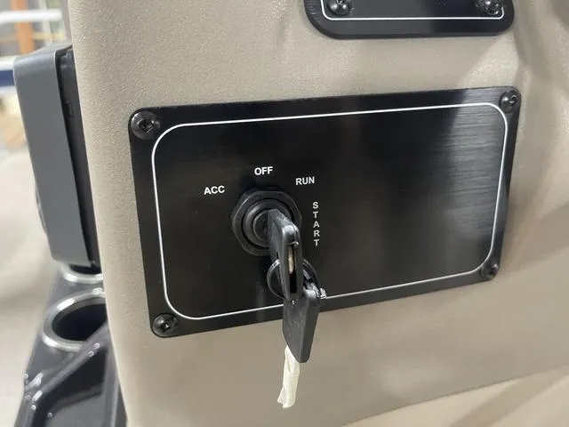 Slide: The Image of 2025 Sun Tracker Bass Buggy 18 DLX interior with steering console and seating. - 19