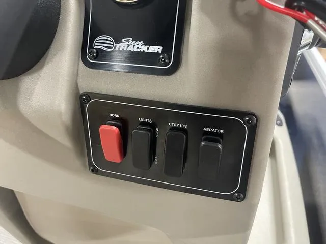 Slide: The Image of Steering console of 2025 Sun Tracker Bass Buggy 18 DLX pontoon boat. - 20