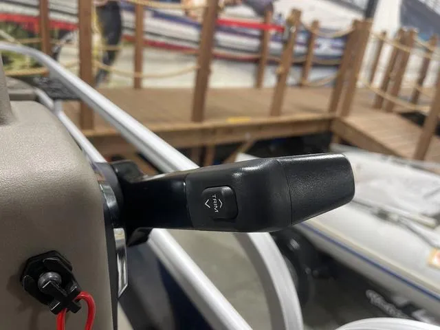 Slide: The Image of 2025 Sun Tracker Bass Buggy 18 DLX boat storage compartment with cup holders. - 21