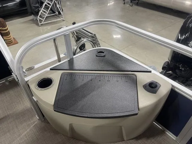 Slide: The Image of 2025 Sun Tracker BASS BUGGY® 18 DLX boat deck with storage and cup holder. - 26