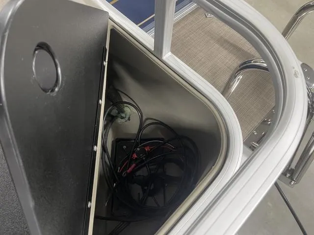 Slide: The Image of Storage compartment with wiring in a 2025 Sun Tracker BASS BUGGY® 18 DLX boat. - 28