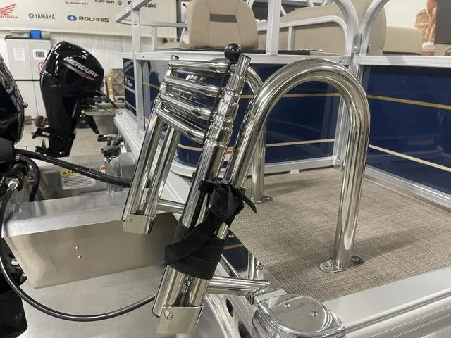 Slide: The Image of 2025 Sun Tracker BASS BUGGY® 18 DLX pontoon boat with folded ladder and Mercury engine. - 30