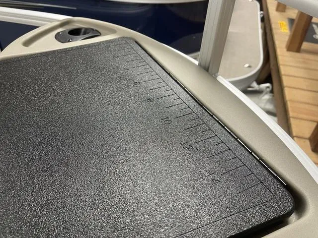 Slide: The Image of 2025 Sun Tracker Bass Buggy 18 DLX pontoon boat in showroom. - 9