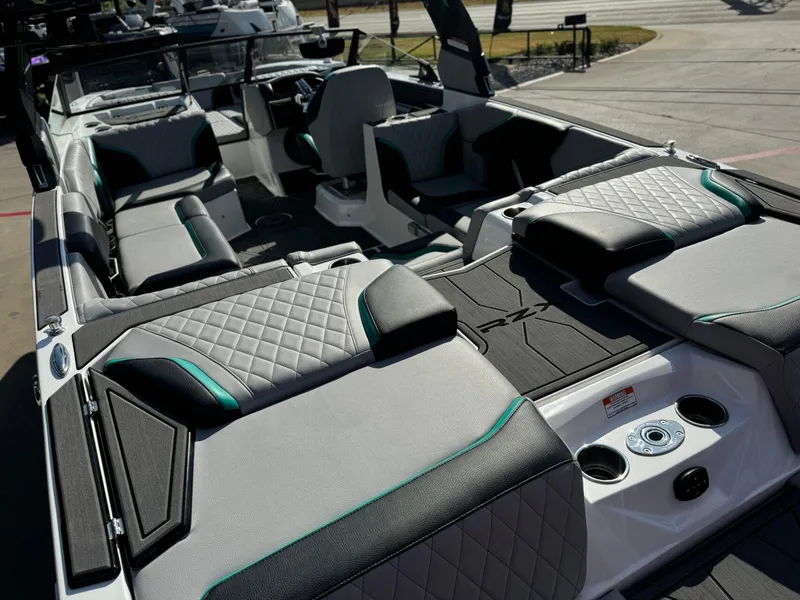 Slide: The Image of 2023 Tigé 24RZX boat interior with luxurious seating and modern design. - 9