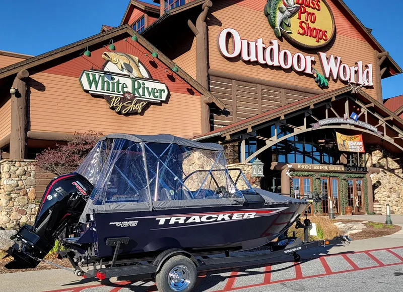 Slide: The Image of 2025 Tracker Pro Guide V-175 Combo boat outside Bass Pro Shops Outdoor World. - 2