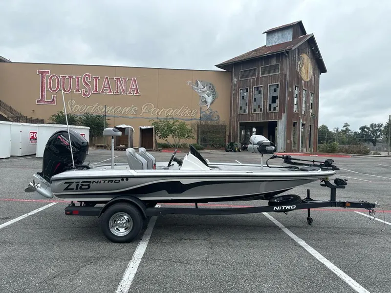 Slide: The Image of 2025 Nitro Z18 boat parked in Louisiana, Sportsman's Paradise backdrop. - 2