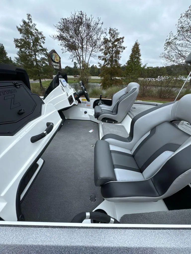 Slide: The Image of 2025 Nitro Z18 boat interior with sleek gray seating and modern dashboard. - 5