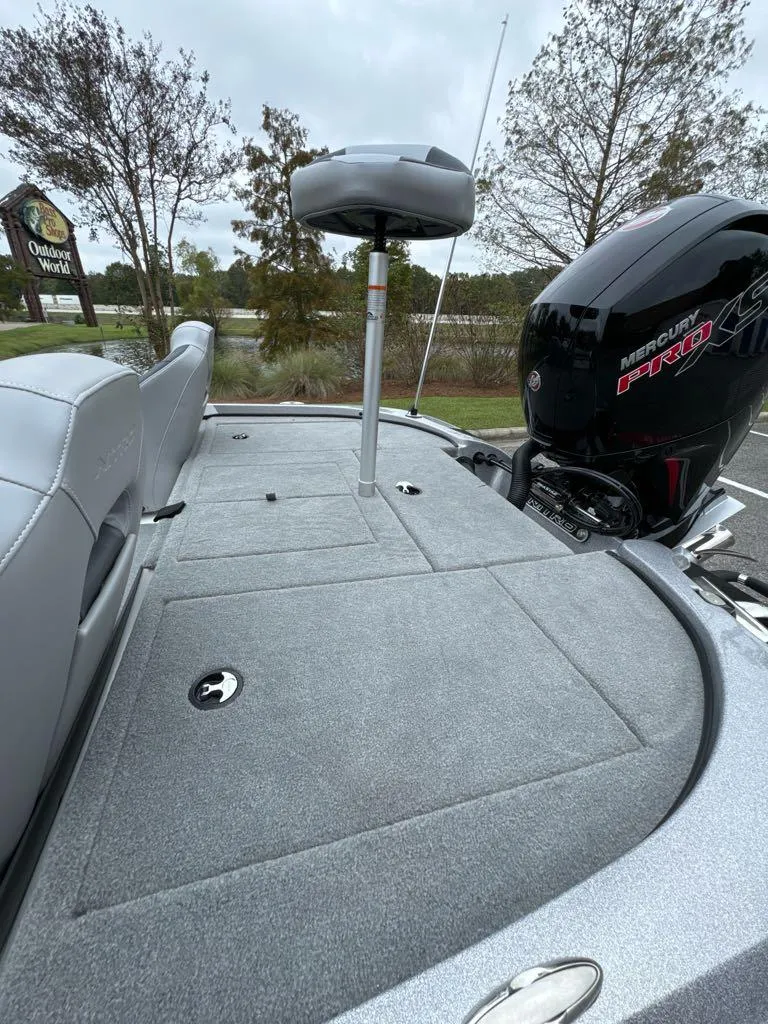 Slide: The Image of 2025 Nitro Z18 boat deck with motor, featuring sleek design and spacious layout. - 6