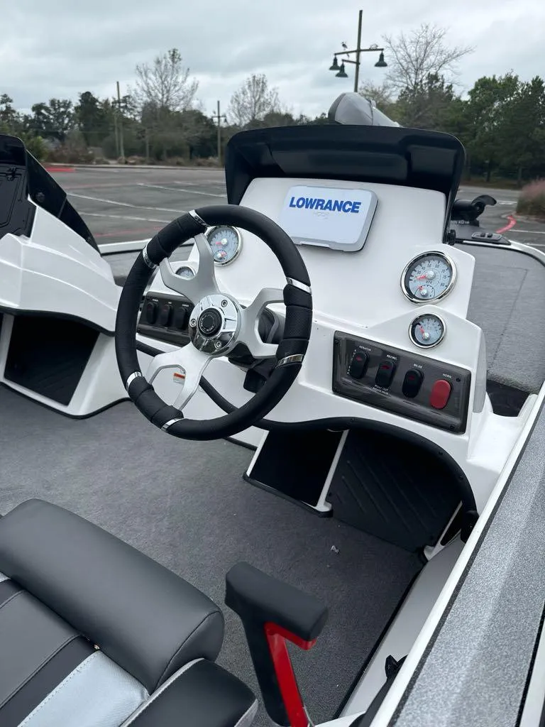 Slide: The Image of 2025 Nitro Z18 boat dashboard with Lowrance electronics and modern steering wheel. - 7