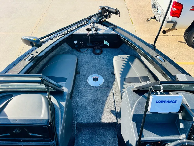Slide: The Image of 2025 Tracker Targa V-18 Combo boat interior with seating and Lowrance equipment. - 10
