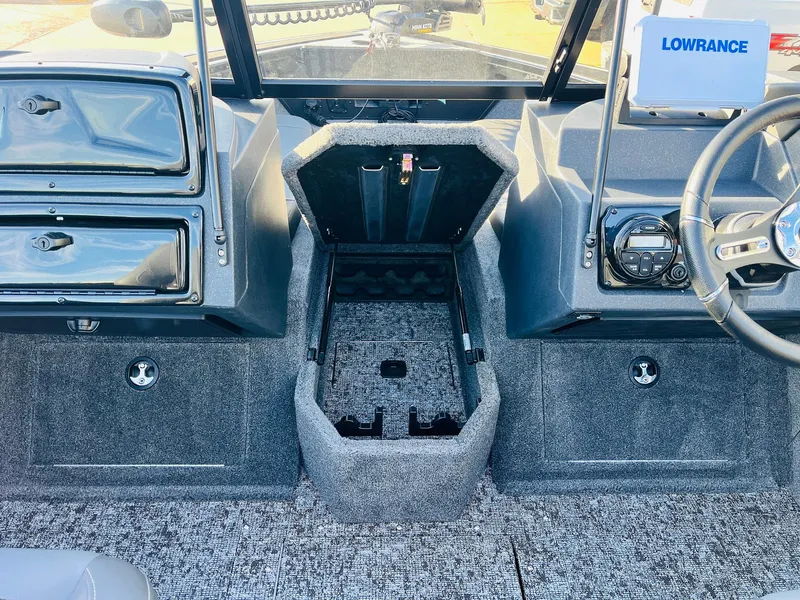 Slide: The Image of 2025 Tracker Targa V-18 Combo boat interior with Lowrance electronics and storage compartments. - 18