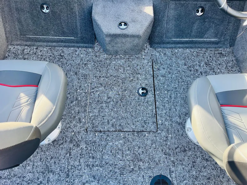 Slide: The Image of 2025 Tracker Targa V-18 Combo boat interior with gray carpet and two seats. - 20