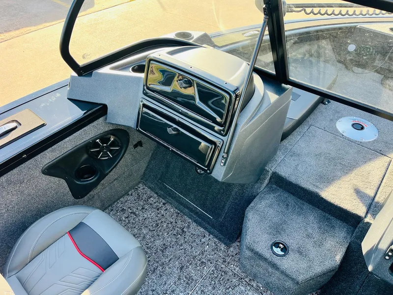 Slide: The Image of 2025 Tracker Targa V-18 Combo boat interior with modern dashboard and seating. - 22