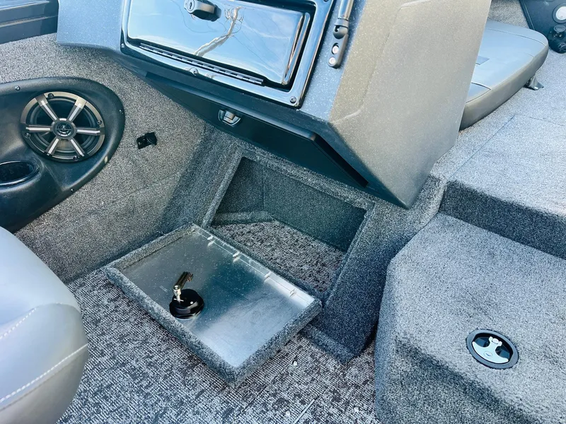 Slide: The Image of 2025 Tracker Targa V-18 Combo boat interior with speaker and storage compartment. - 25