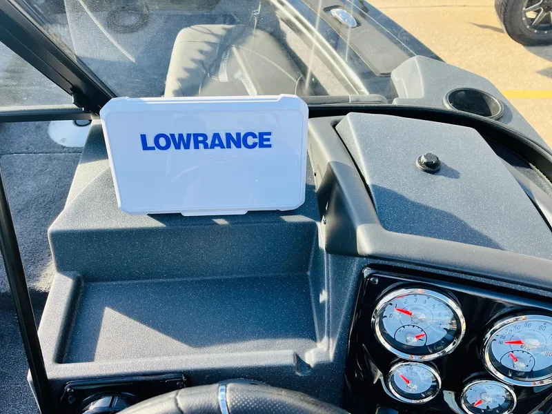 Slide: The Image of 2025 Tracker Targa V-18 Combo dashboard with Lowrance display and gauges. - 27