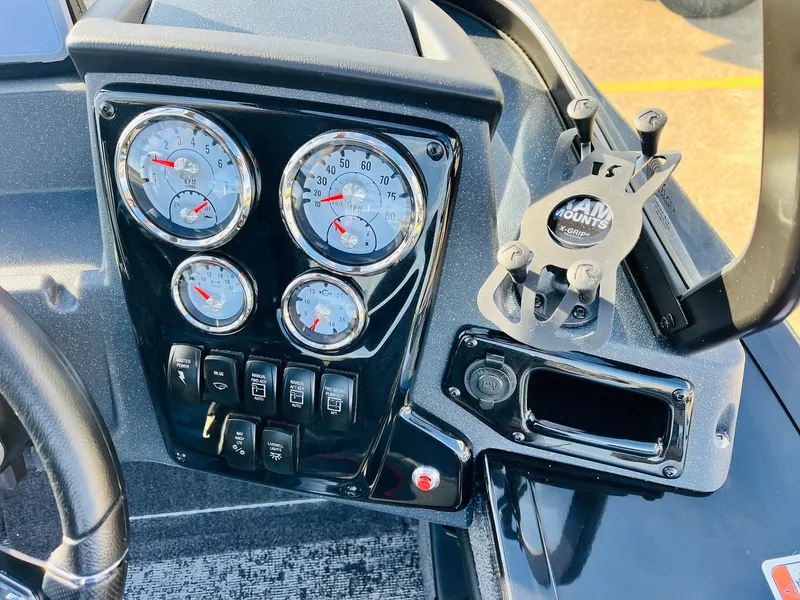 Slide: The Image of Dashboard of 2025 Tracker Targa V-18 Combo boat with gauges and controls. - 31