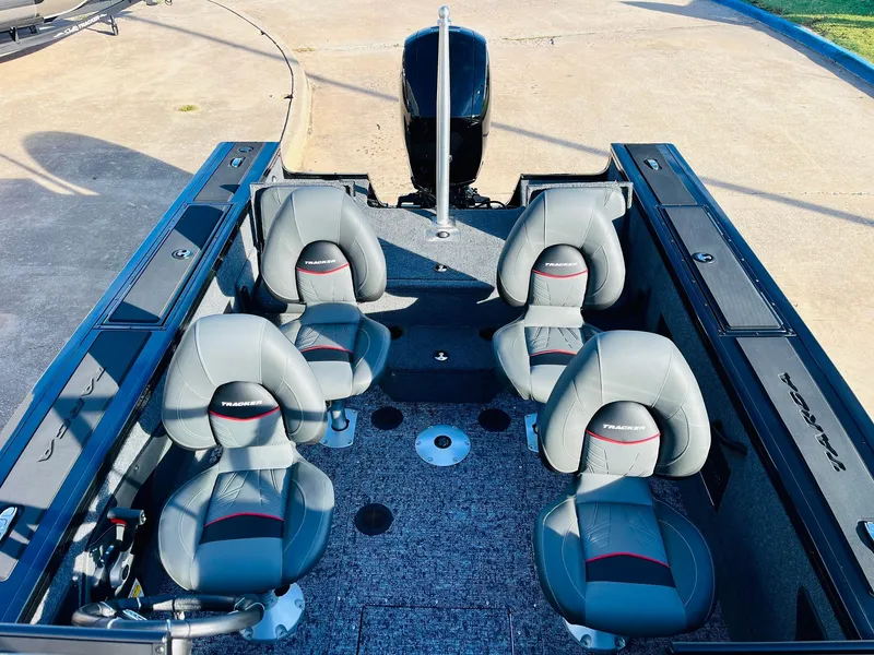 Slide: The Image of 2025 Tracker Targa V-18 Combo boat interior with four gray seats and spacious layout. - 32