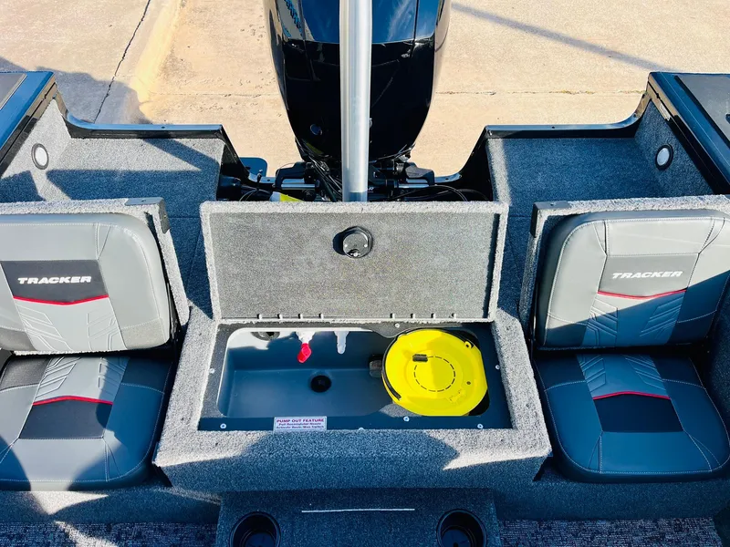 Slide: The Image of 2025 Tracker Targa V-18 Combo boat interior with storage compartment and seating. - 38