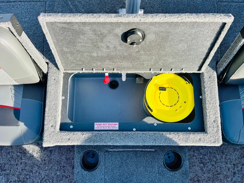 Slide: The Image of 2025 Tracker Targa V-18 Combo boat storage compartment with yellow container. - 39