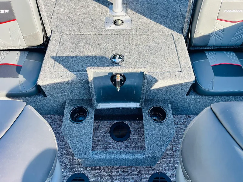 Slide: The Image of 2025 Tracker Targa V-18 Combo boat interior with seating and cup holders. - 40