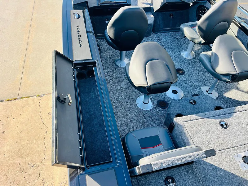 Slide: The Image of 2025 Tracker Targa V-18 Combo boat interior with seating and storage compartments. - 41