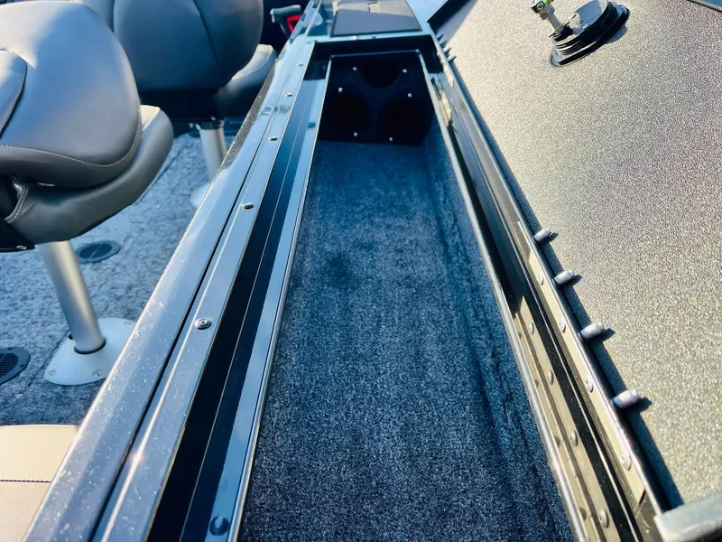 Slide: The Image of 2025 Tracker Targa V-18 Combo boat interior storage compartment with seating. - 44