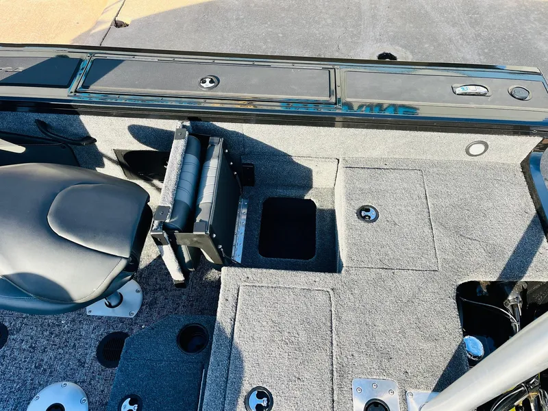 Slide: The Image of 2025 Tracker Targa V-18 Combo boat interior with seating and storage compartments. - 46