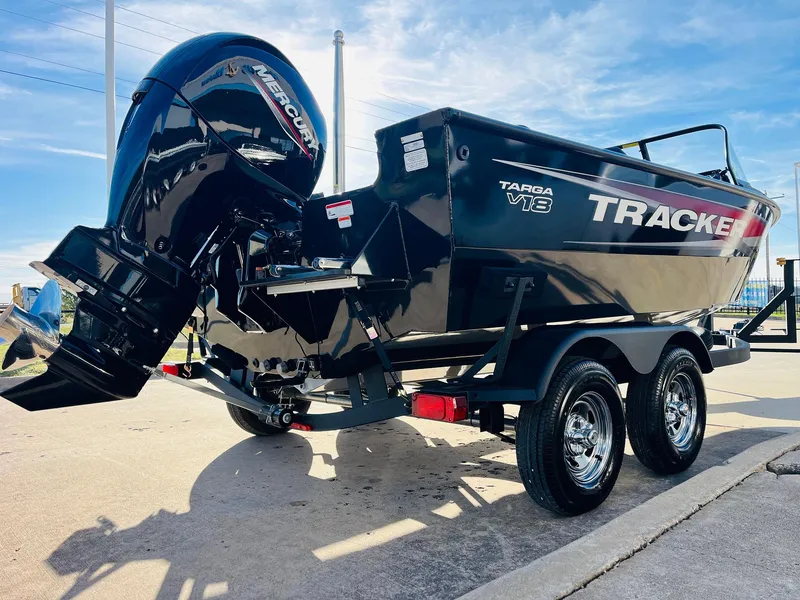 Slide: The Image of 2025 Tracker Targa V-18 Combo boat with Mercury outboard engine on a trailer. - 5