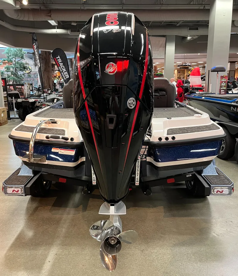 Slide: The Image of 2025 Nitro Z20 XL Pro boat with powerful outboard motor displayed indoors. - 6