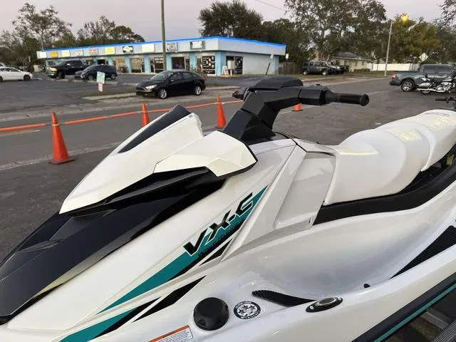 Slide: The Image of 2025 Yamaha Marine Waverunner VX-C in white and black, parked outdoors near a store. - 13