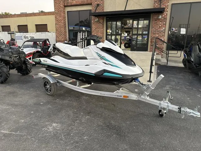 Slide: The Image of 2025 Yamaha Marine Waverunner VX-C in white and black, sleek design, side view. - 2
