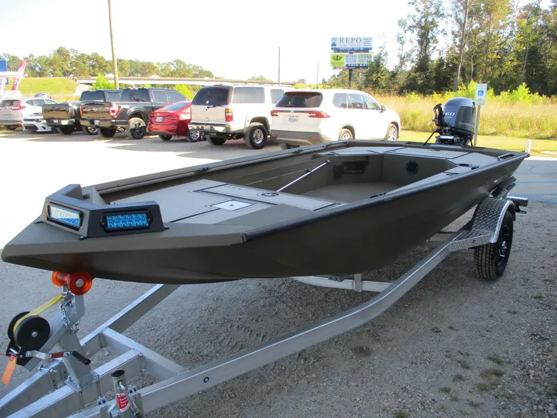 Slide: The Image of 2025 Avid 16 Commander boat on trailer in parking lot. - 3