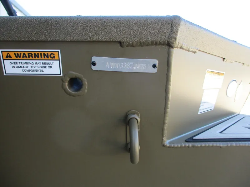 Slide: The Image of 2025 Avid 16 Commander boat with warning label and identification plate. - 9