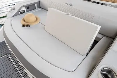 Slide: The Image of 2025 Sea Ray SLX 310 Outboard boat with spacious seating and stylish design. - 12