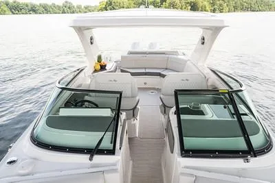 Slide: The Image of 2025 Sea Ray SLX 310 Outboard boat interior with spacious seating and modern design. - 4