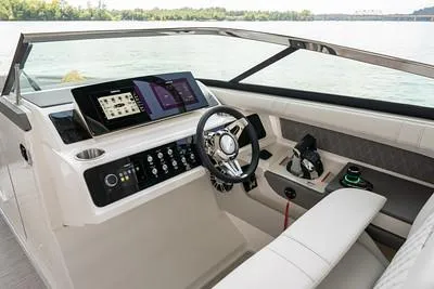 Slide: The Image of 2025 Sea Ray SLX 310 Outboard cockpit with modern controls and sleek design. - 6