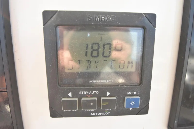 Slide: The Image of Simrad autopilot display on 1999 Carolina Classic 28 Express boat. - 13